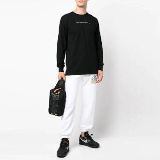 T-shirt noir à manches longues et col rond avec logo flèche imprimé en coton